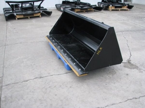 HLA skid steer bucket showing bolt on cutting edge